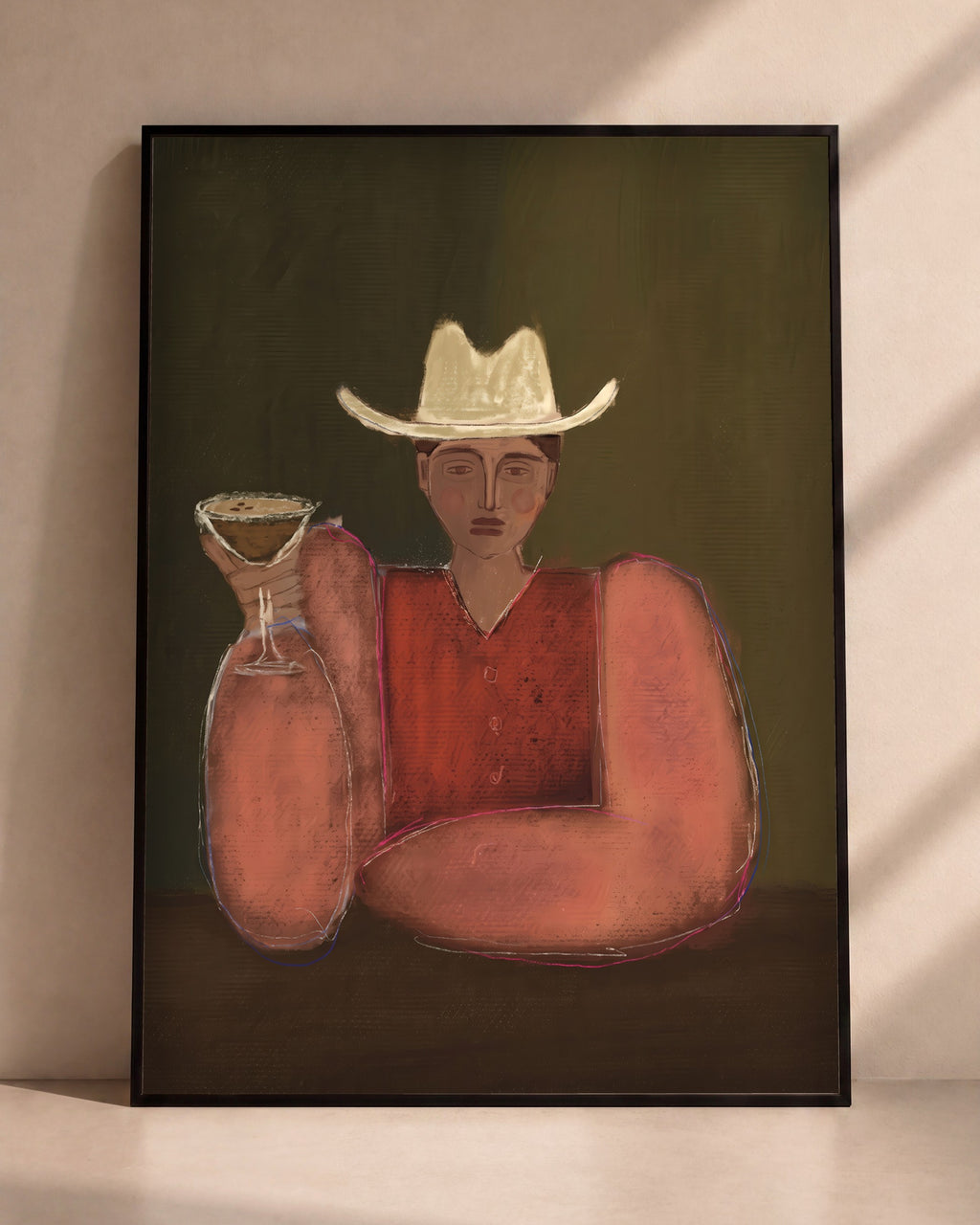 Plakat Kowboj z martini w czarnej ramie opartej o ścianę
