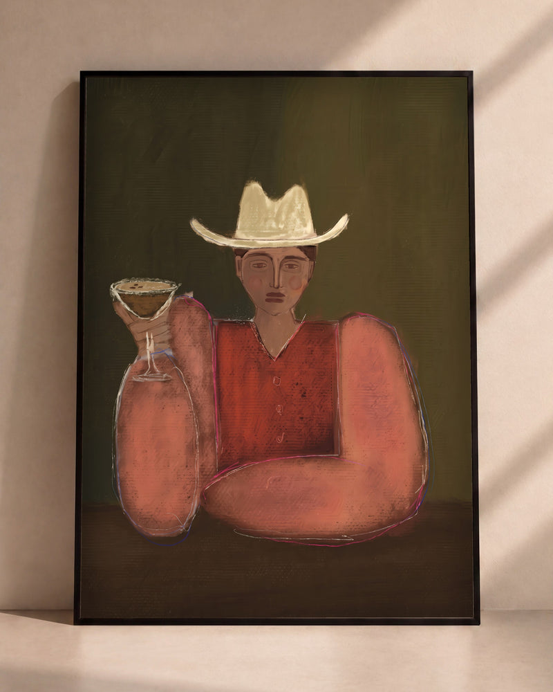 Plakat Kowboj z martini w czarnej ramie opartej o ścianę
