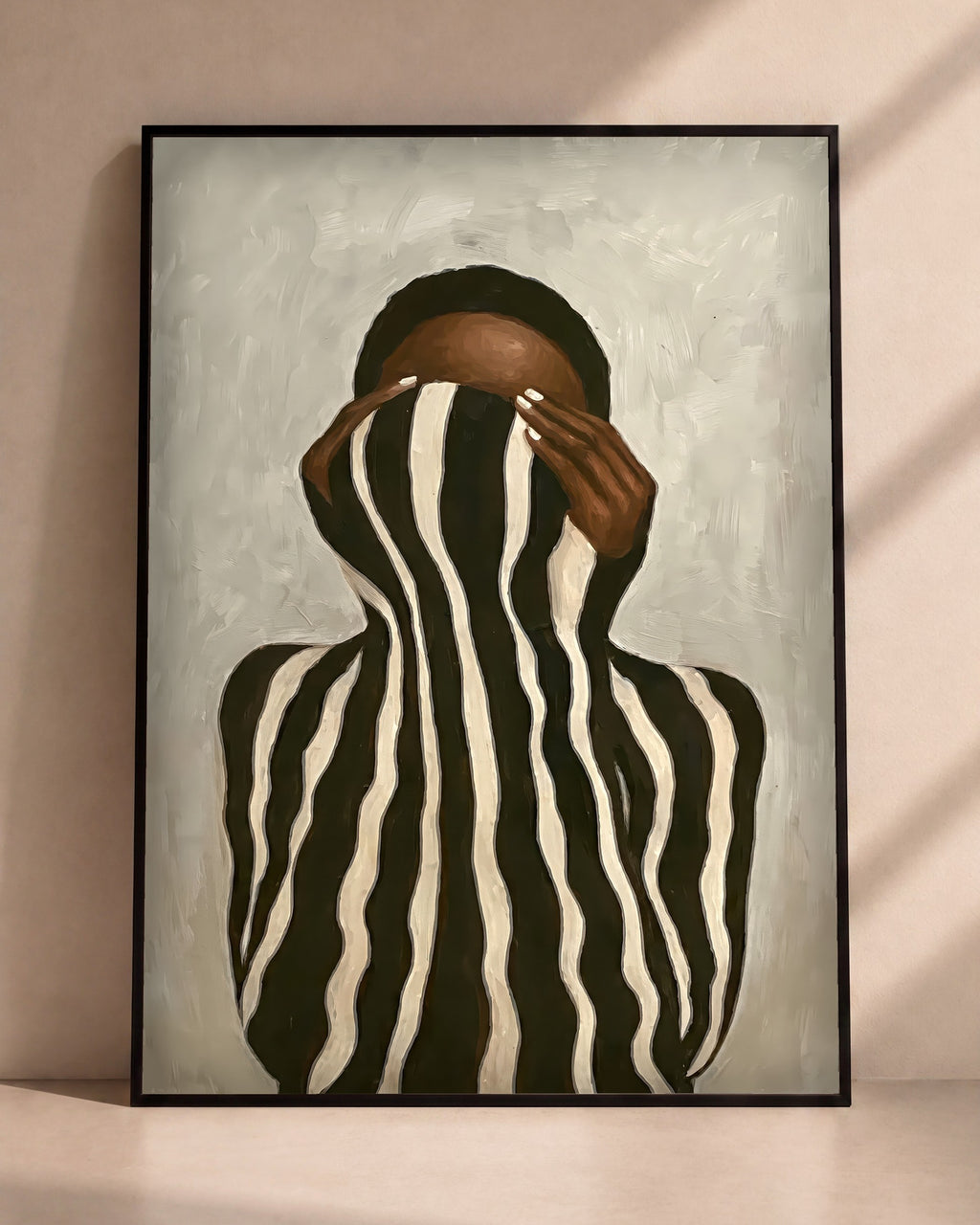 Plakat Zebra w czarnej ramie opartej o ścianę